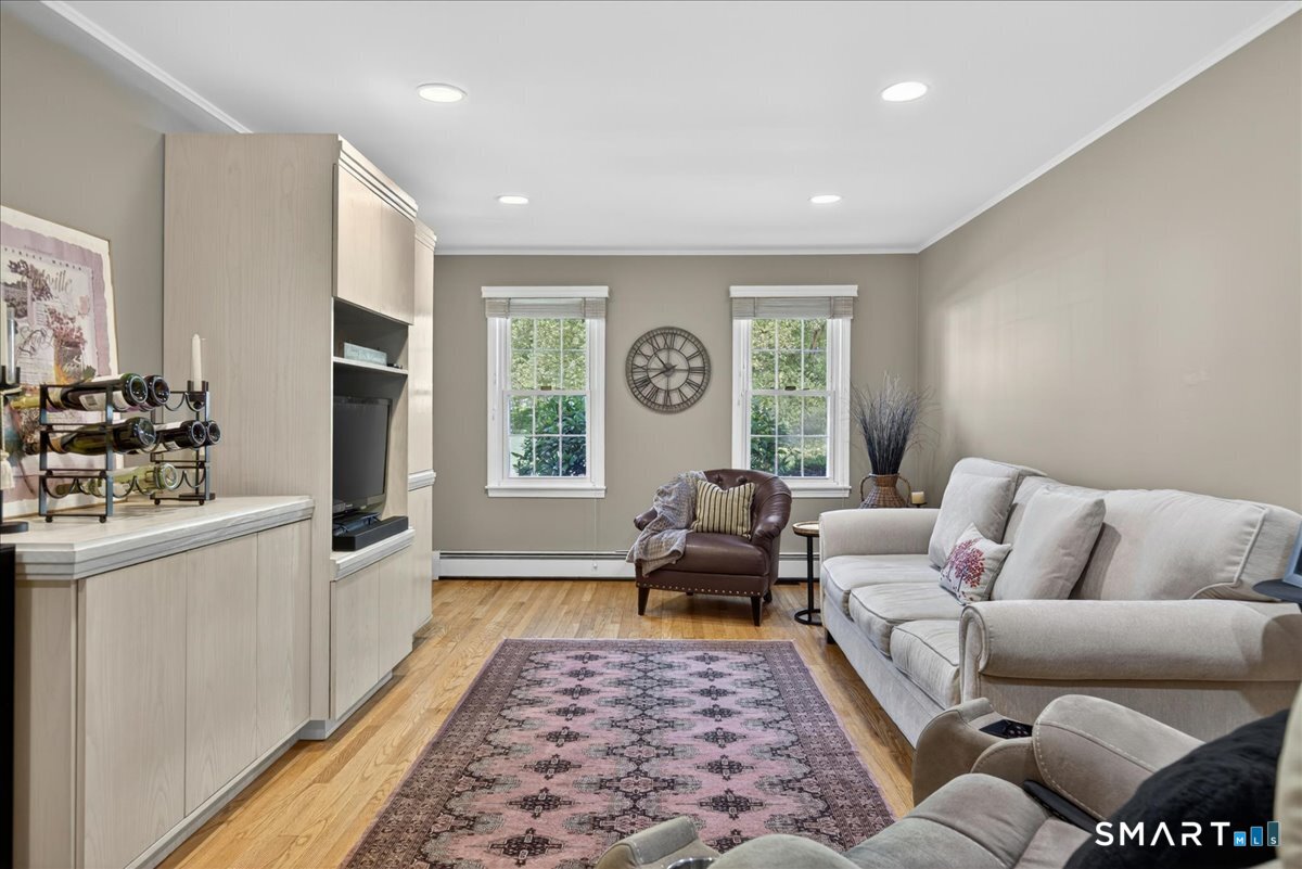 11 Bender Road Hamden, CT 06518 - Photo 14 of 40 a living room with furniture and a rug