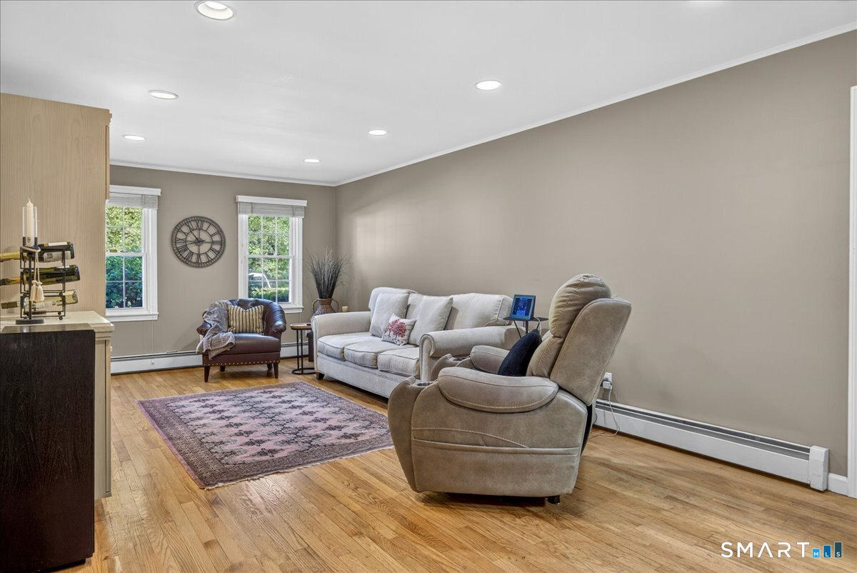 11 Bender Road Hamden, CT 06518 - Photo 15 of 40 a living room with furniture and a rug