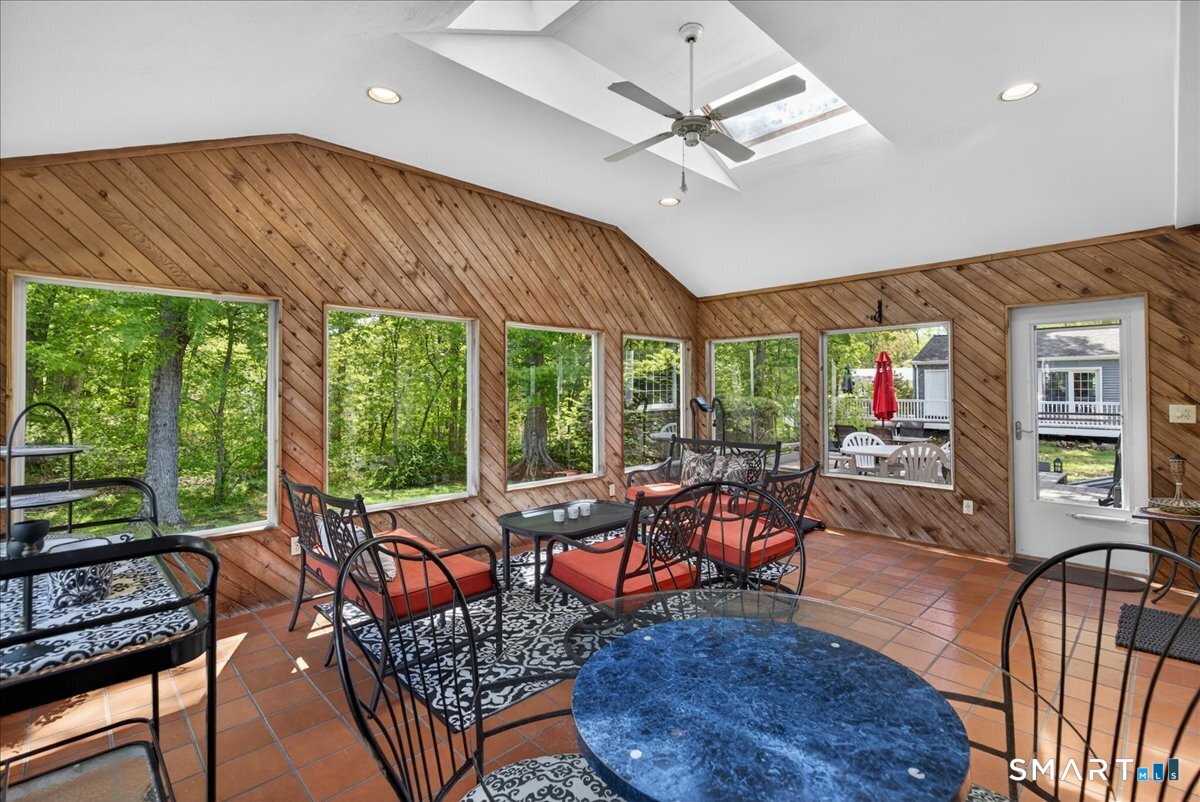 11 Bender Road Hamden, CT 06518 - Photo 18 of 40 a living room with furniture a ceiling fan and a large window