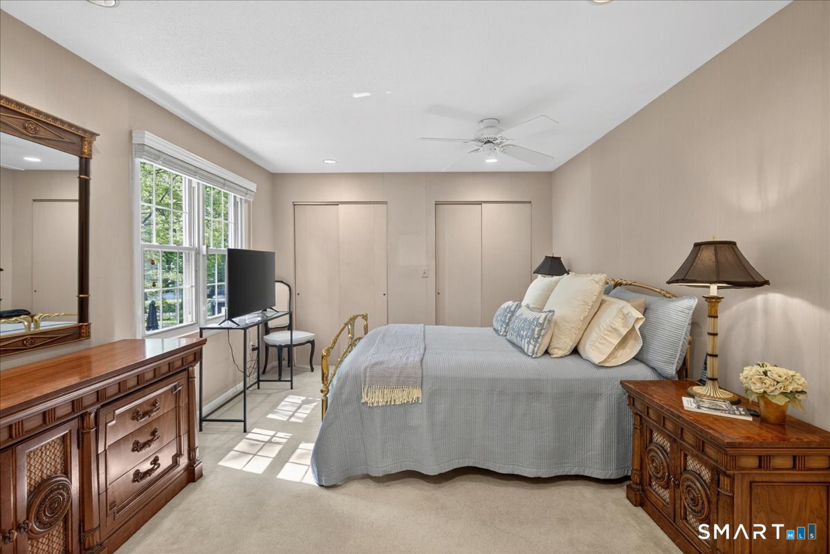 11 Bender Road Hamden, CT 06518 - Photo 22 of 40 a bedroom with a bed and large windows