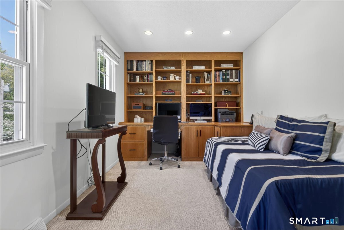 11 Bender Road Hamden, CT 06518 - Photo 23 of 40 a bedroom with a bed a flat screen tv and a window