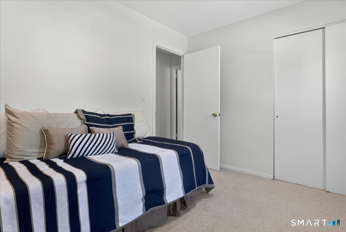 11 Bender Road Hamden, CT 06518 - Photo 24 of 40 a bedroom with a bed and a night stand