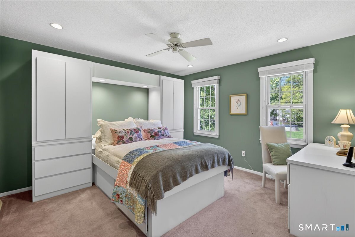 11 Bender Road Hamden, CT 06518 - Photo 25 of 40 a bedroom with a bed and a table