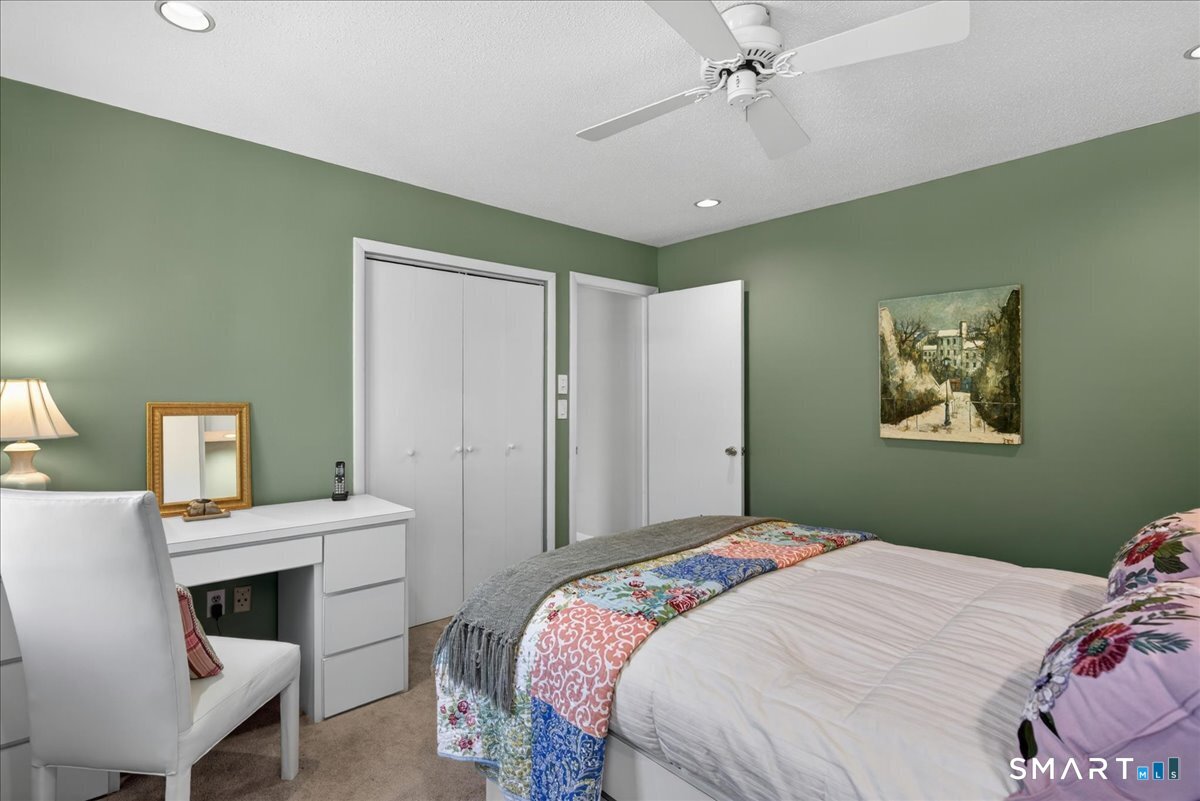 11 Bender Road Hamden, CT 06518 - Photo 26 of 40 a bedroom with a bed and a table