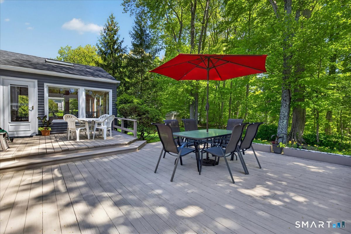 11 Bender Road Hamden, CT 06518 - Photo 28 of 40 a view of a house with backyard sitting area and garden