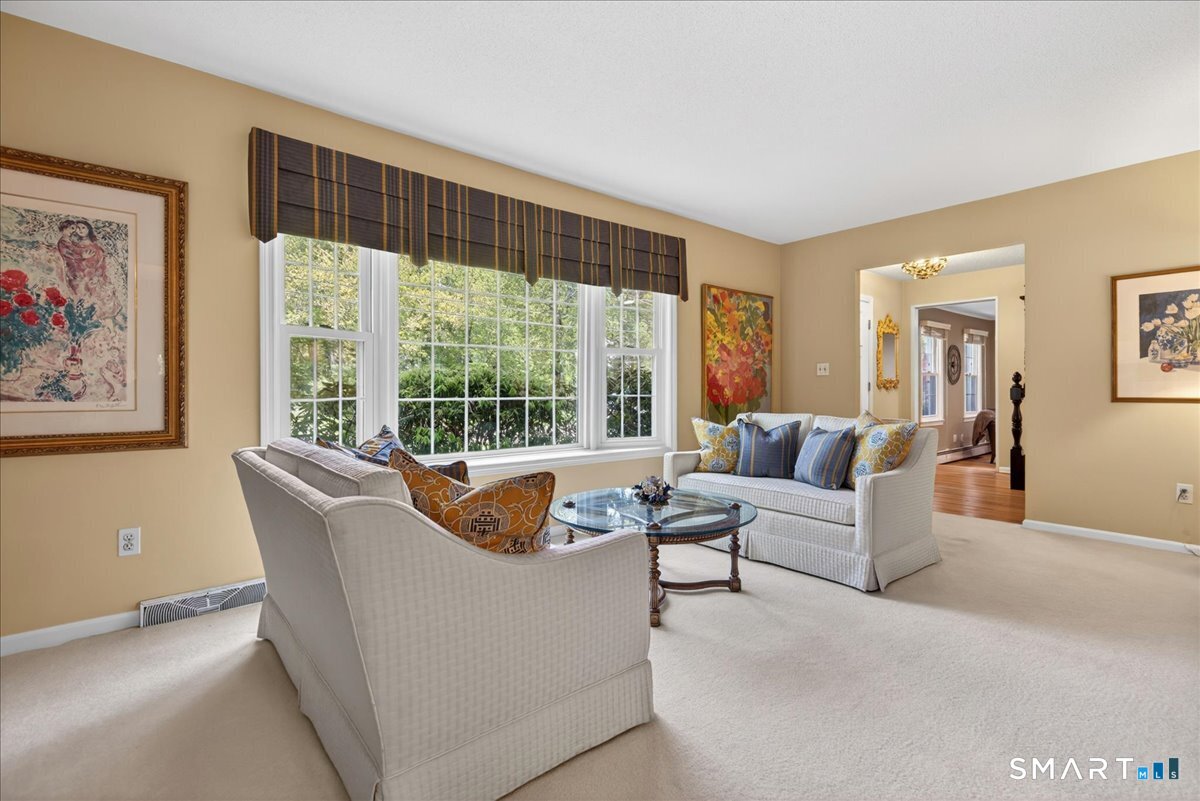 11 Bender Road Hamden, CT 06518 - Photo 3 of 40 a living room with furniture and a large window