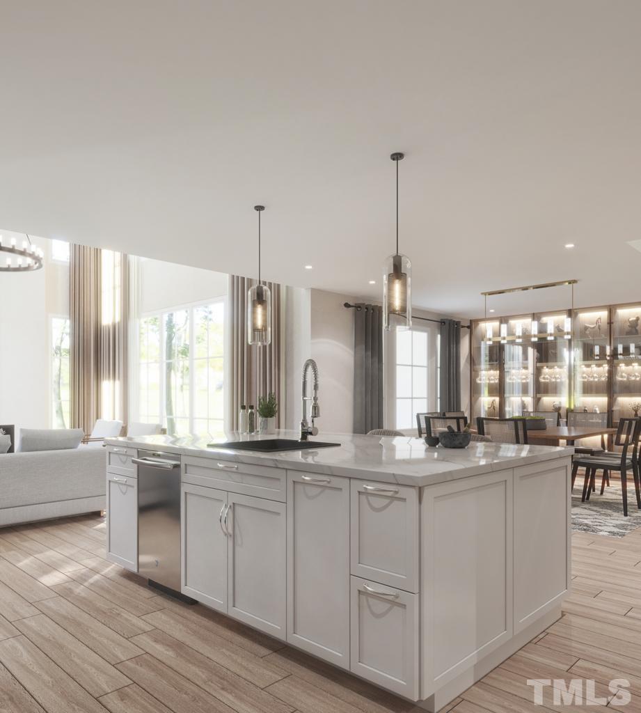 47 Treviso Place Durham, NC 27707 - Photo 23 of 38 a large kitchen with kitchen island granite countertop a large window and white cabinets