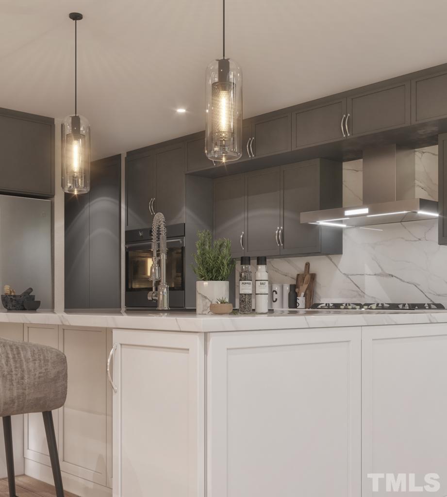 47 Treviso Place Durham, NC 27707 - Photo 24 of 38 a kitchen with kitchen island granite countertop a sink a counter space appliances and cabinets