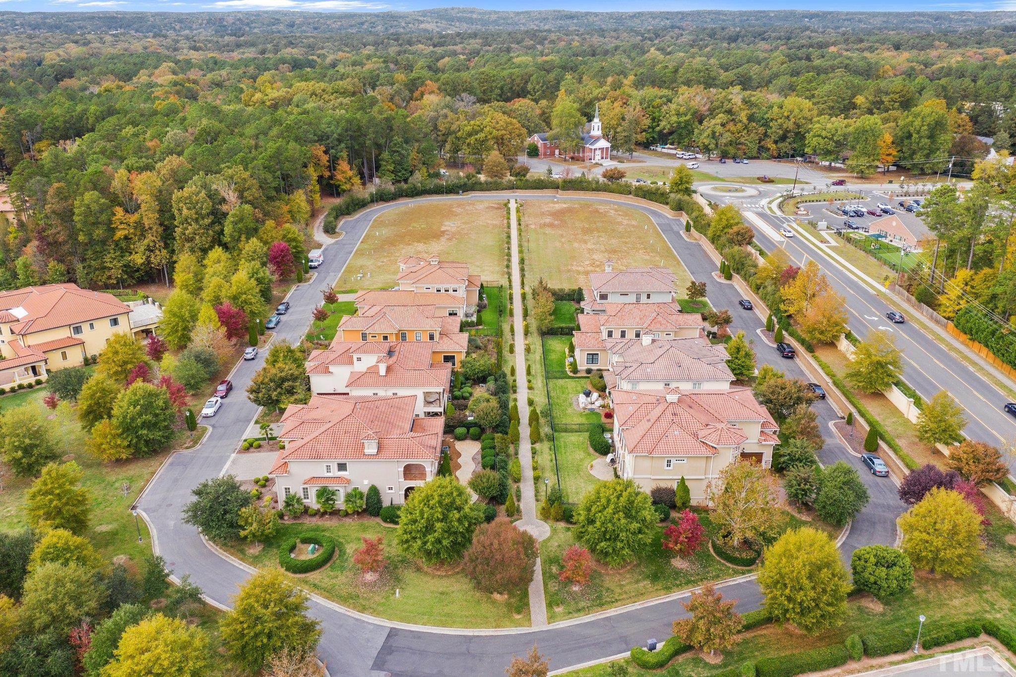47 Treviso Place Durham, NC 27707 - Photo 28 of 38 an aerial view of house with yard swimming pool and mountains