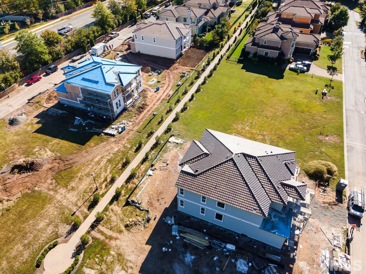 47 Treviso Place Durham, NC 27707 - Photo 36 of 38 aerial view of a house with a yard