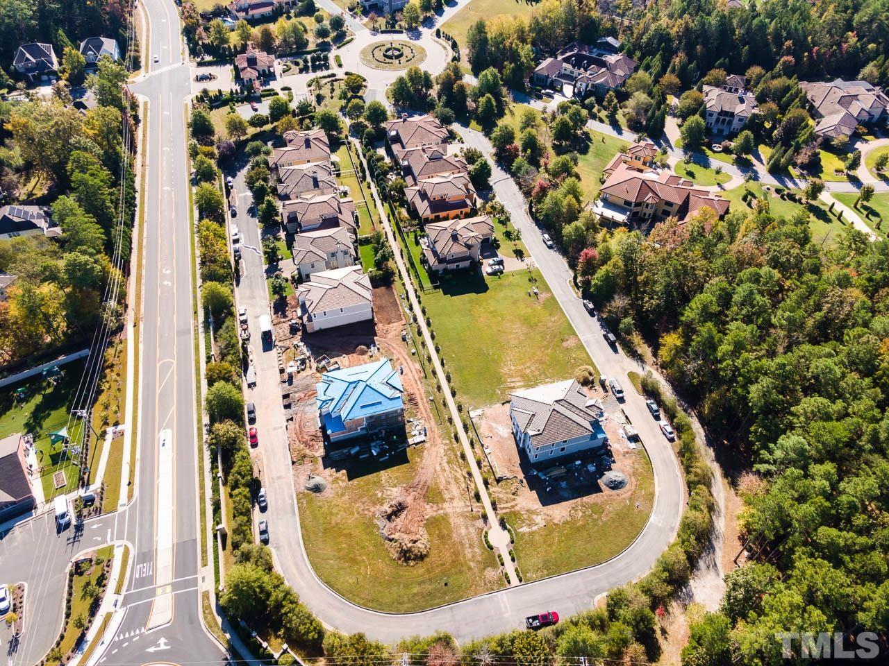 47 Treviso Place Durham, NC 27707 - Photo 38 of 38 an aerial view of a house with swimming pool and outdoor seating