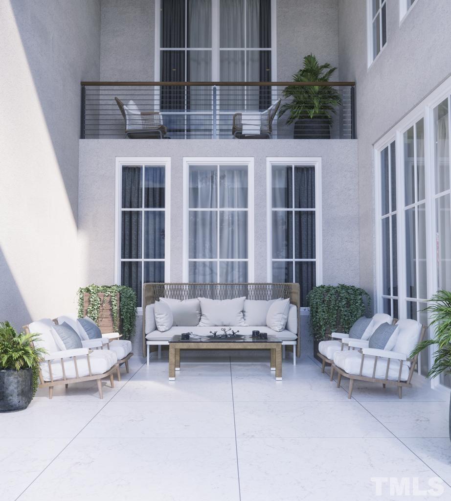 47 Treviso Place Durham, NC 27707 - Photo 7 of 38 a living room with furniture and flowers potted plants