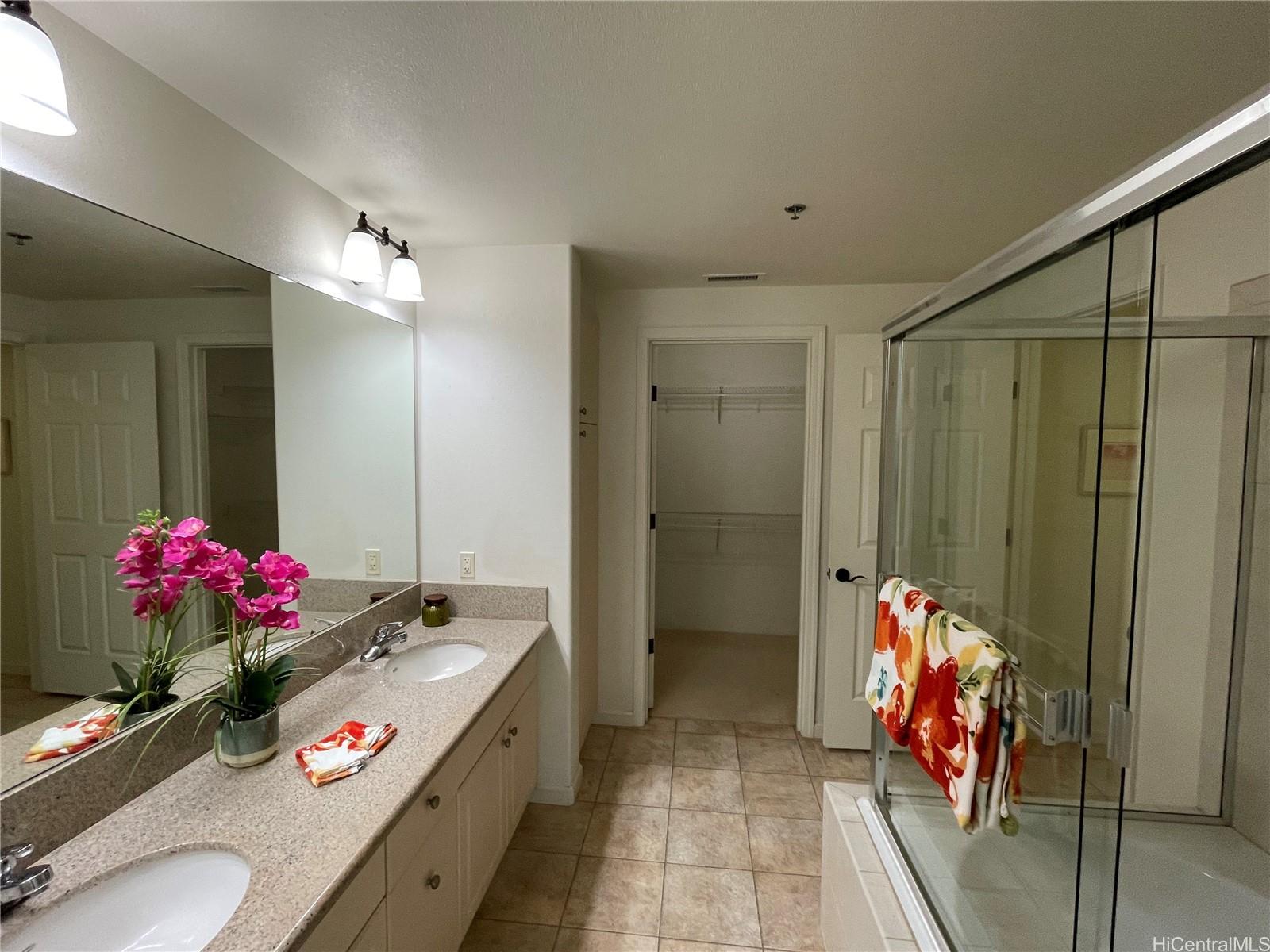 520 Lunalilo Home Road, Unit 8225 Honolulu, HI 96825 - Photo 12 of 25 a view of bathroom with shower and chandelier