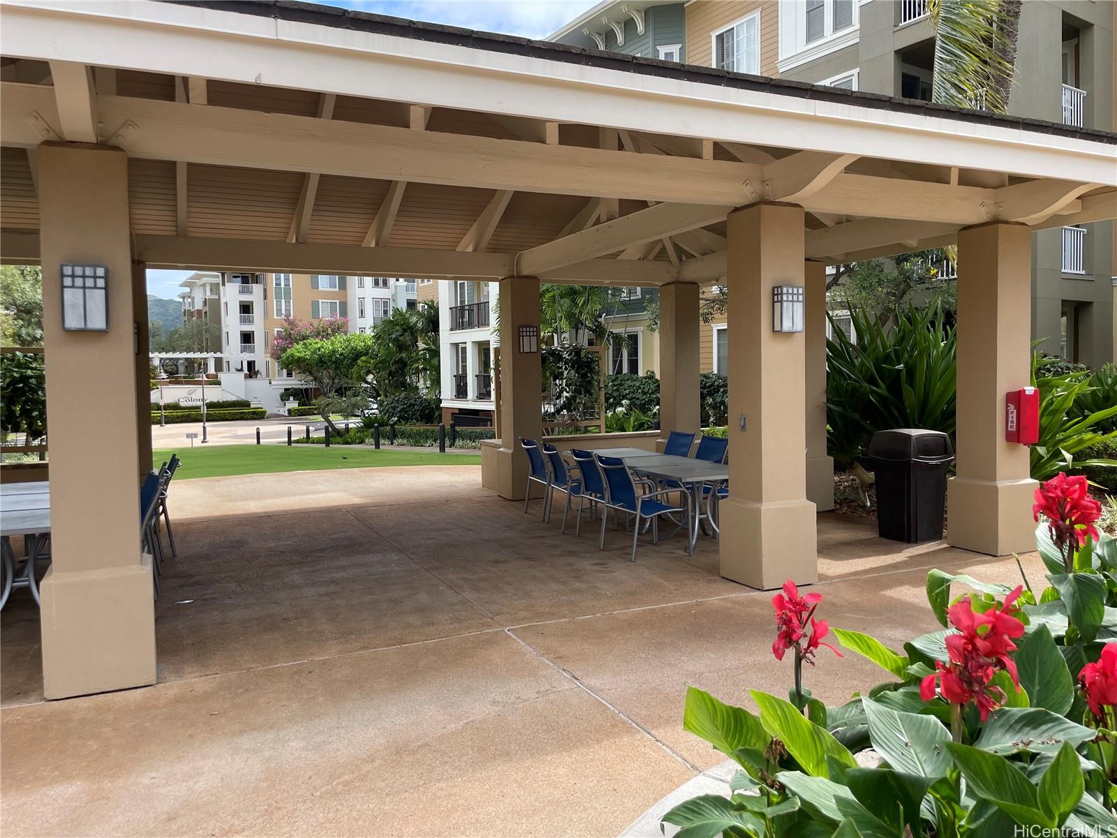 520 Lunalilo Home Road, Unit 8225 Honolulu, HI 96825 - Photo 25 of 25 a view of a patio with table and chairs potted plants