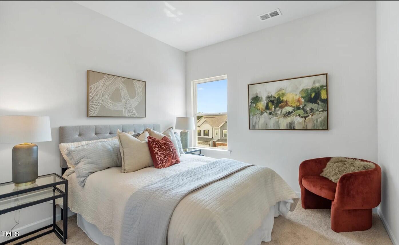 732 Orch Vista Circle Raleigh, NC 27606 - Photo 15 of 19 a bedroom with bed and a couch