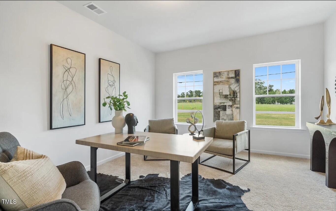 732 Orch Vista Circle Raleigh, NC 27606 - Photo 2 of 19 a dining room with furniture and window