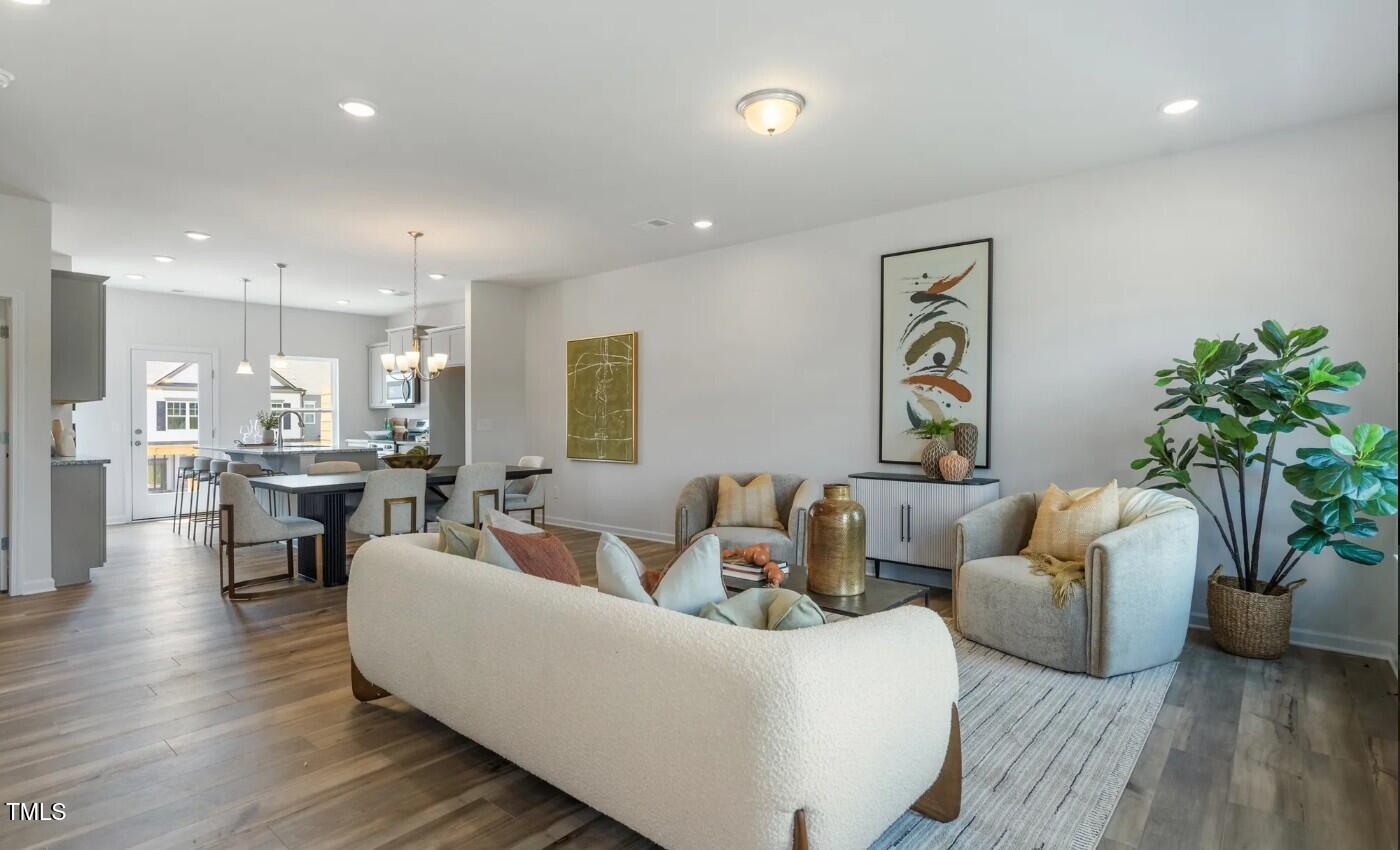 732 Orch Vista Circle Raleigh, NC 27606 - Photo 3 of 19 a living room with furniture and wooden floor