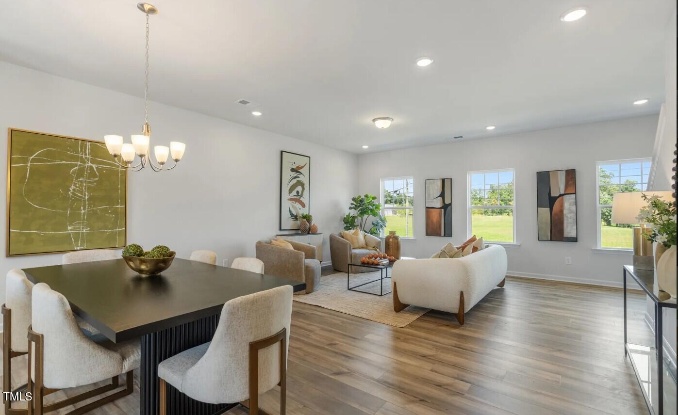732 Orch Vista Circle Raleigh, NC 27606 - Photo 5 of 19 a living room with furniture wooden floor and a table