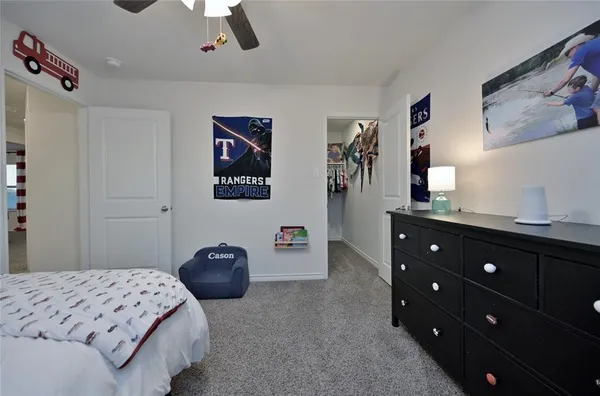 a bedroom with a bed and cabinets