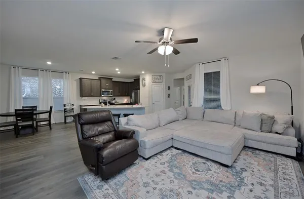 a kitchen with sink cabinets and dining table