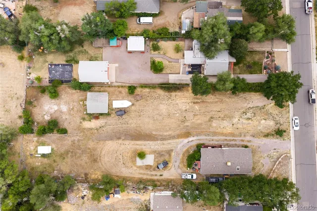 an aerial view of residential houses with outdoor space