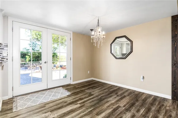a kitchen with stainless steel appliances and white cabinets