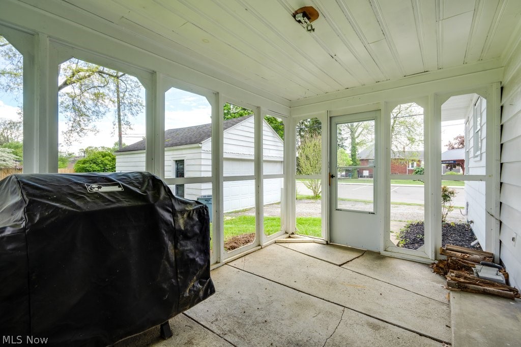 3569 Elm Road Stow, OH 44224 - Photo 12 of 17 Screened porch with concrete flooring and white painted wood ceiling