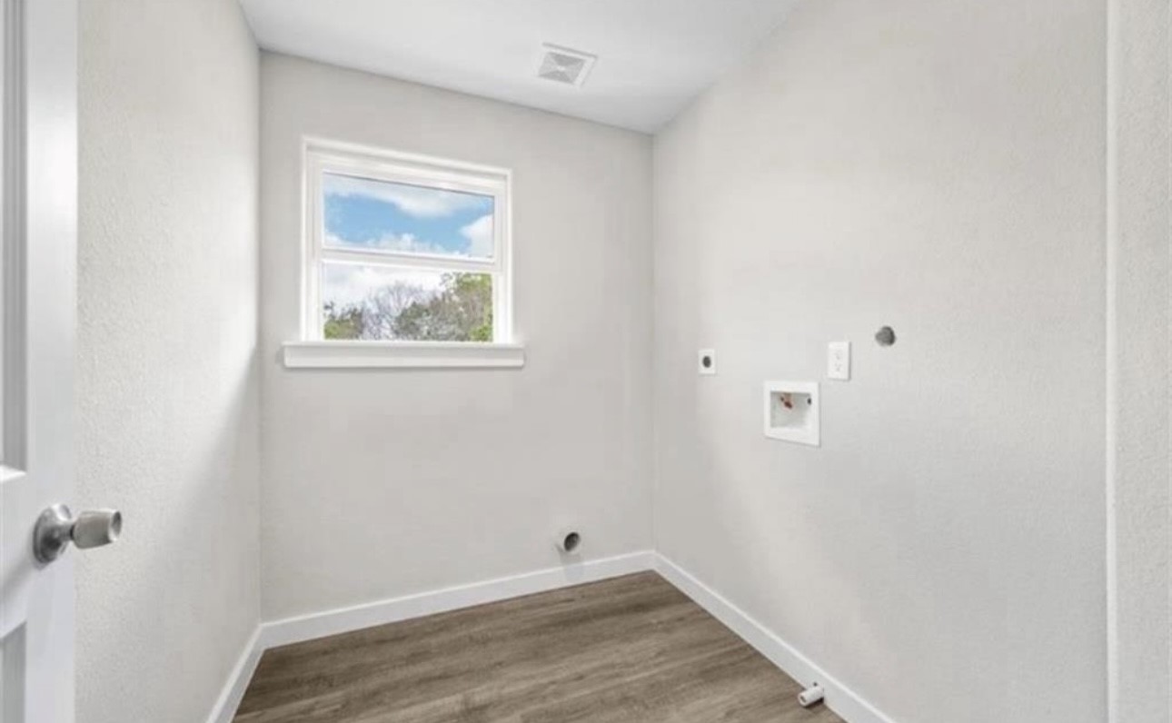 6801 Haight Street, Unit B Houston, TX 77028 - Photo 7 of 8 a view of small space with wooden floor and a window