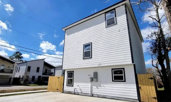 a view of a house with a street