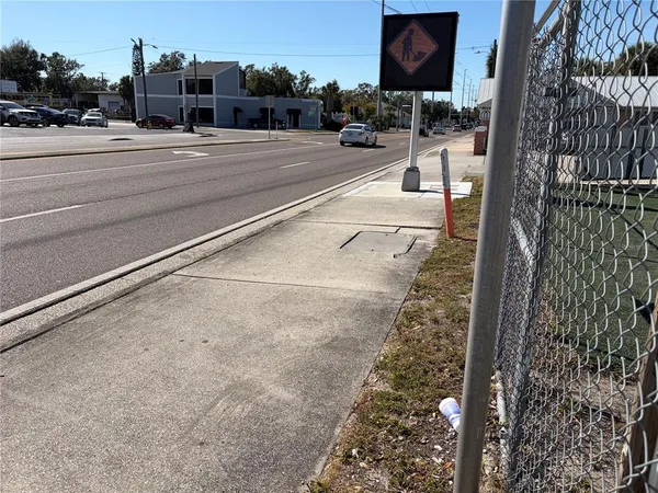a view of a room with wooden floor and front door