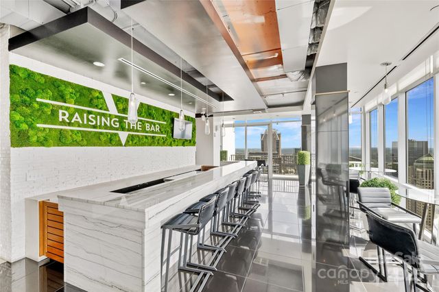 a room with furniture and a large window