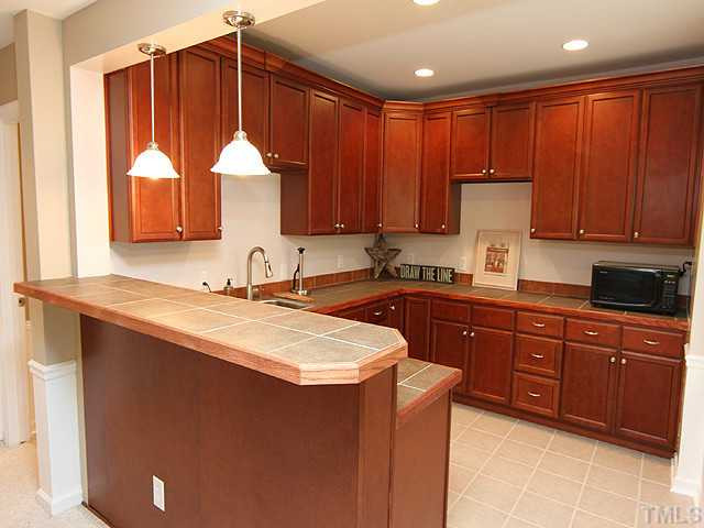 7732 Silver View Lane Raleigh, NC 27613 - Photo 13 of 25 Lower level 'kitchenette' -- adjacent to the lower level family room, play room, media center and pool table area! Interior Space/Layout