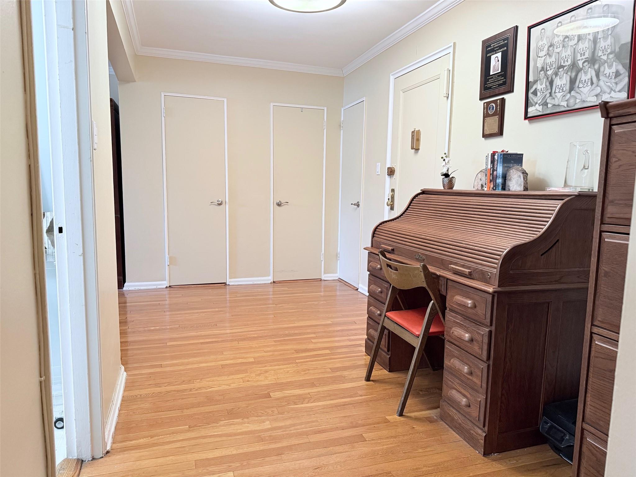 83-15 98th Street, Unit 3C Queens, NY 11421 - Photo 4 of 12 a room that has a bed and a table in it