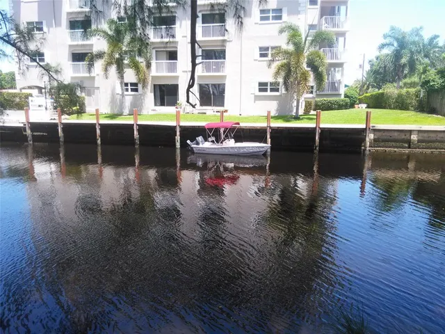 a swimming pool view with a outdoor seating