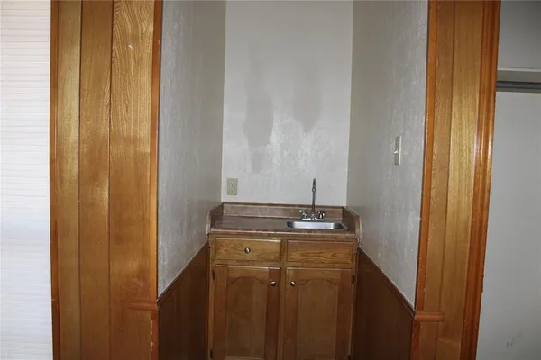a bathroom with a sink and vanity