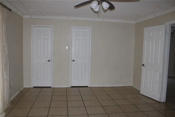 a view of an empty room and closet area