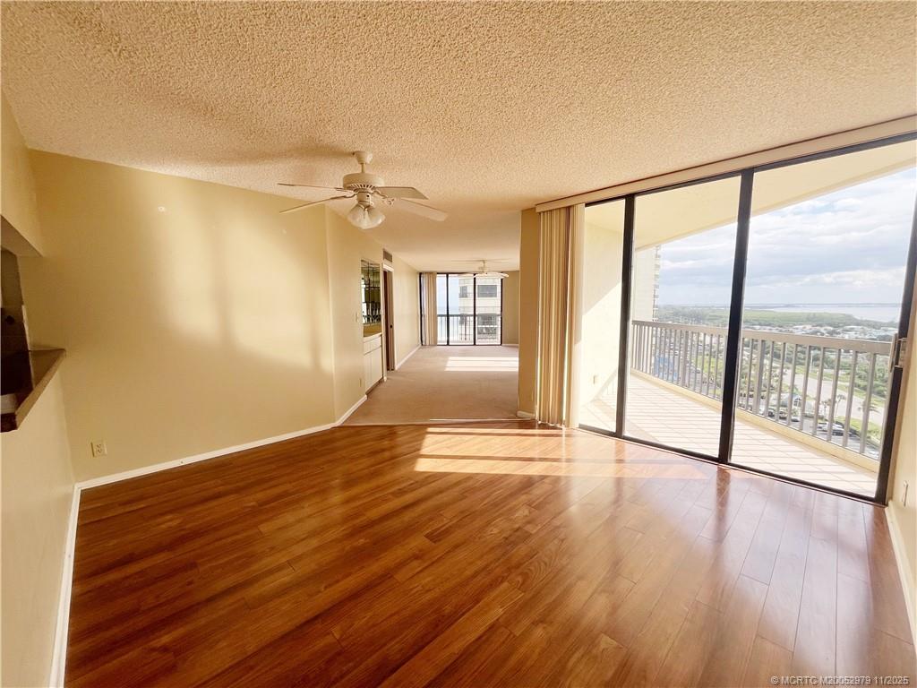 9500 South Ocean Drive, Unit 1410 Jensen Beach, FL 34957 - Photo 2 of 17 wooden floor in an empty room with a window
