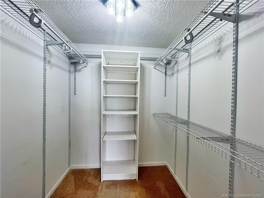 9500 South Ocean Drive, Unit 1410 Jensen Beach, FL 34957 - Photo 8 of 17 a view of walk in closet with empty racks