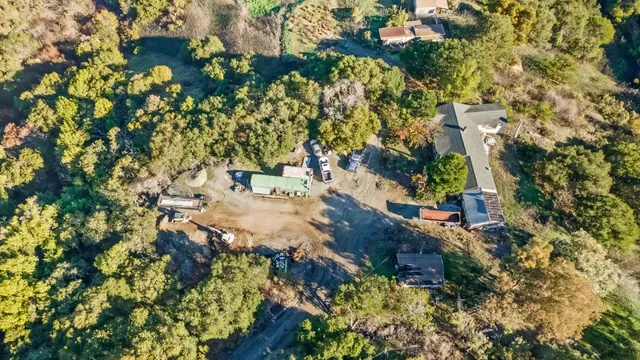 an aerial view of residential house with outdoor space