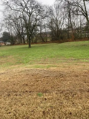 a view of a field with an outdoor space