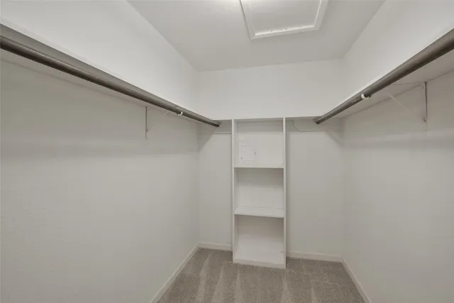 a bathroom with a shower a toilet and sink