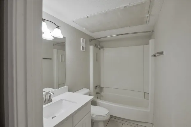 a view of a house with a tree in front of it