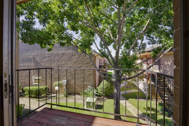 a view of a chair and table in backyard