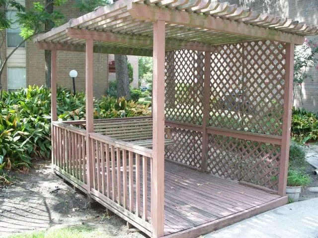 a front view of a house with a yard garage and outdoor seating