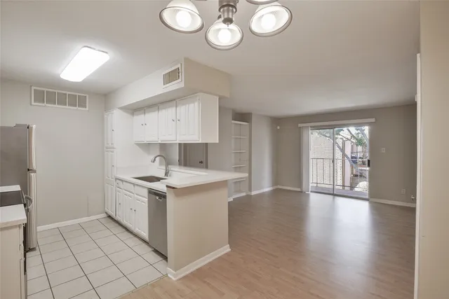 an empty room with a empty space and a window