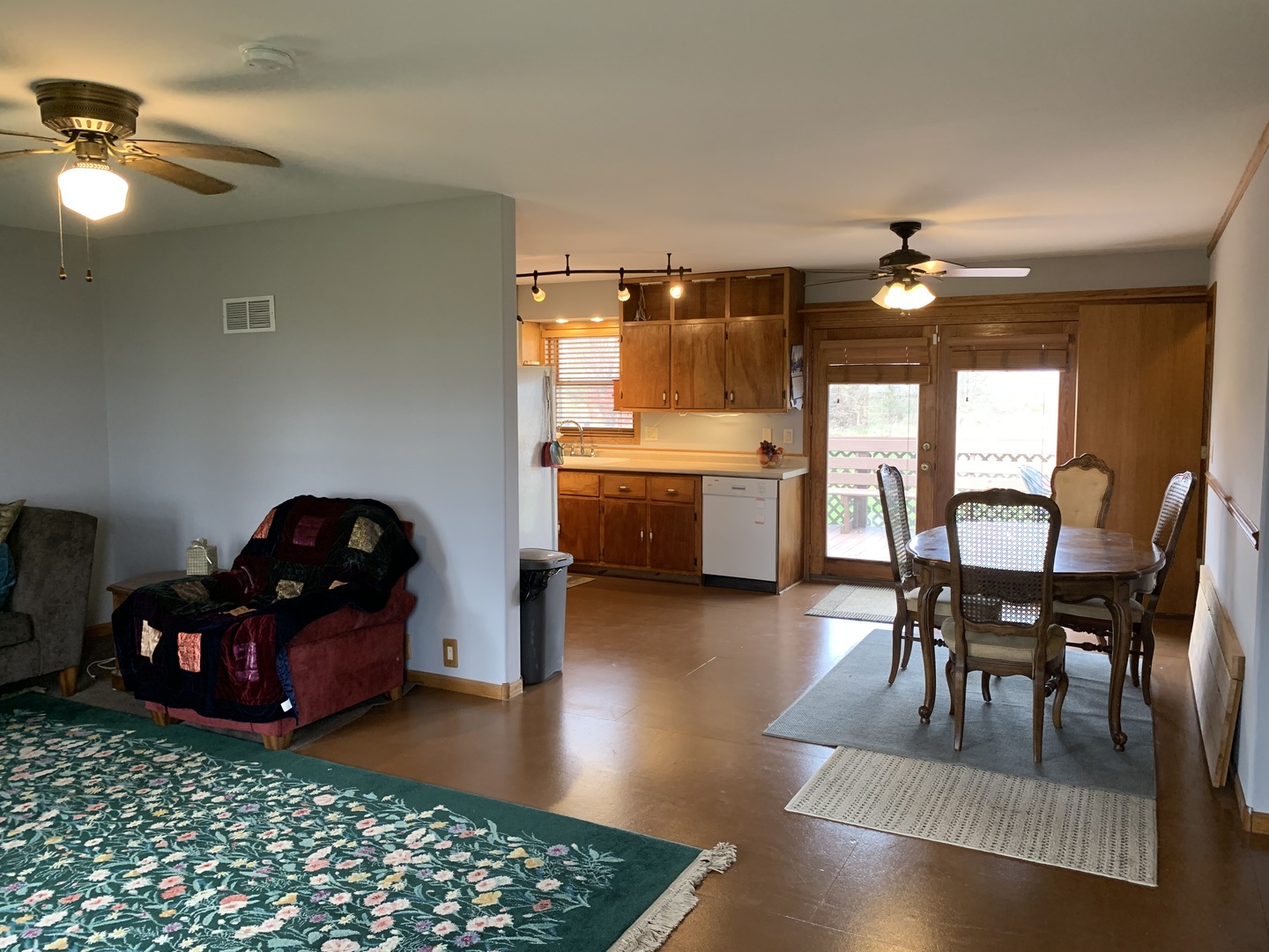 9245 West 2000 S Road Bonfield, IL 60913 - Photo 3 of 27 a living room with furniture and a dining table with kitchen view