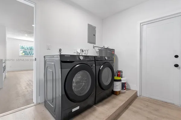 a utility room with dryer and washer