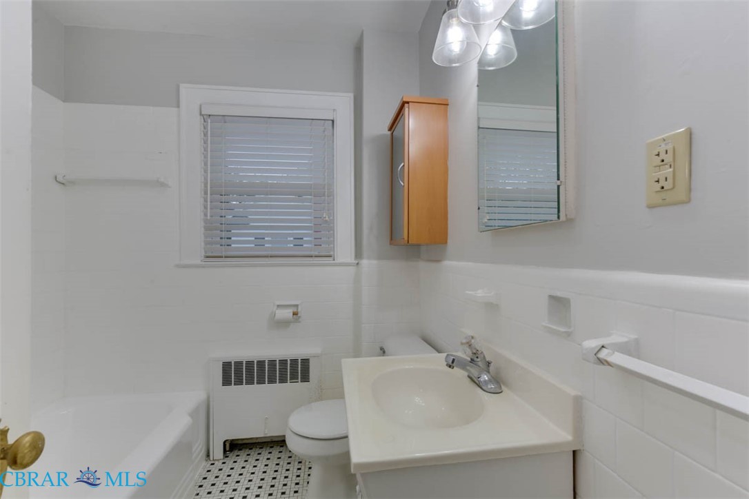 144 Meredith Street Hampton, VA 23669 - Photo 30 of 36 a bathroom with a sink toilet and shower