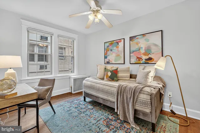 a bedroom with furniture and a window