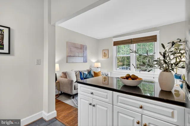 a kitchen with a sink and large window
